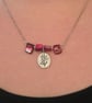 Pink mother of pearl beaded necklace with silver floral charm - Image 3