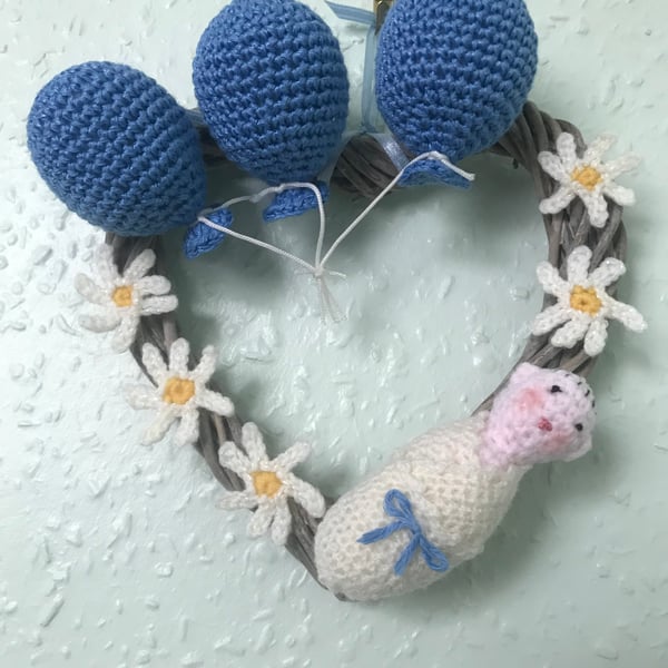 Wicker heart wreath hand decorated with crochet items 