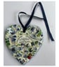 A heart shaped mosaic pendant with violets, the state flower of Rhode Island.
