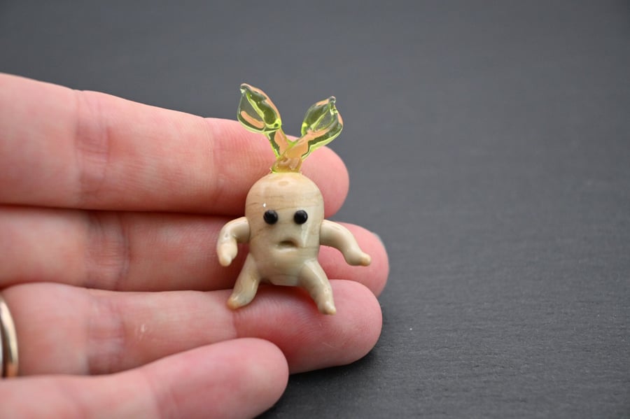 small glass mandrake figure