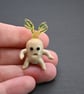 small glass mandrake figure