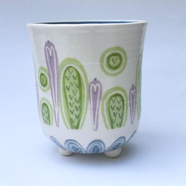 Ceramic hand thrown pot with feet