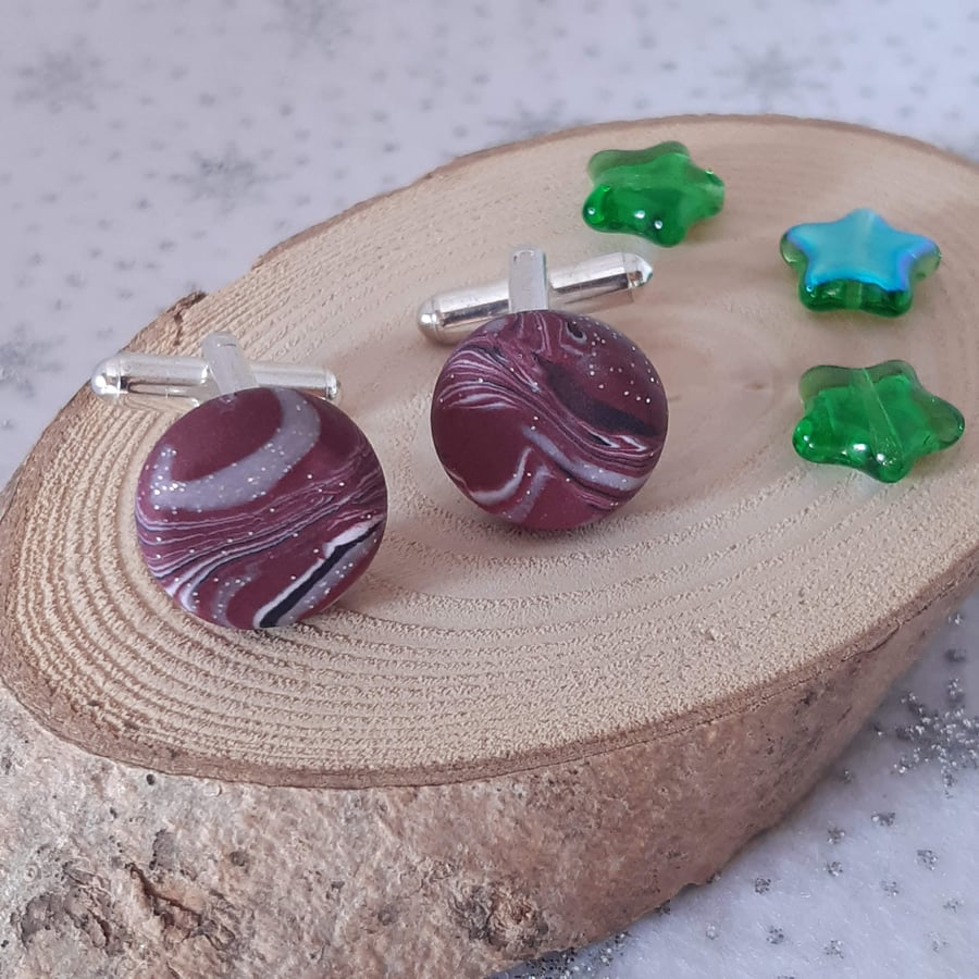 Men's cufflinks in a cerise, black and white swirl design