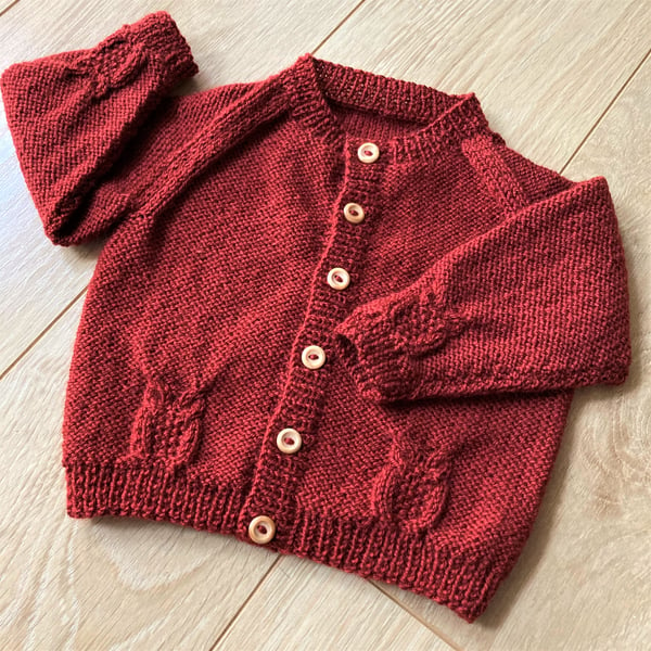 Child's hand knitted cardigan in rust to fit 12 to 18 months