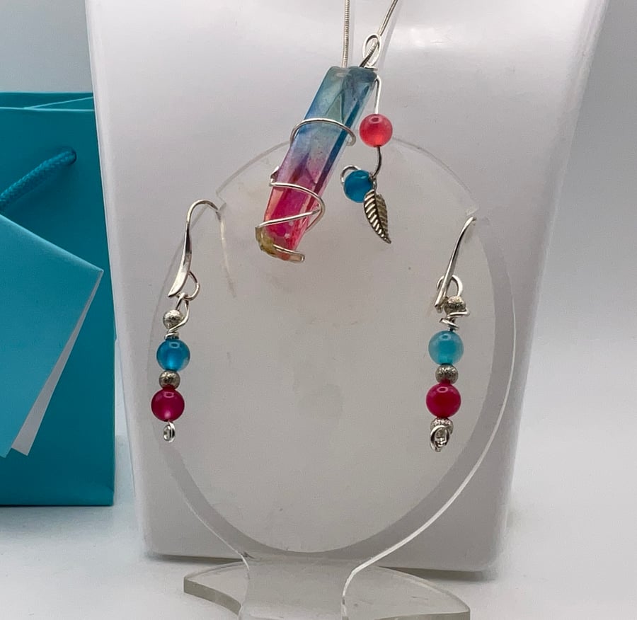 A delightful tiny pink and blue gemstone point pendant with matching earrings