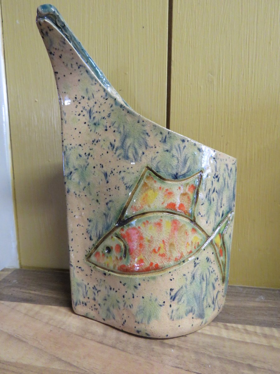 Slab built ceramic vase with fish design