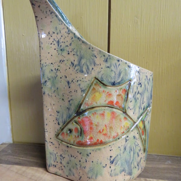 Slab built ceramic vase with fish design