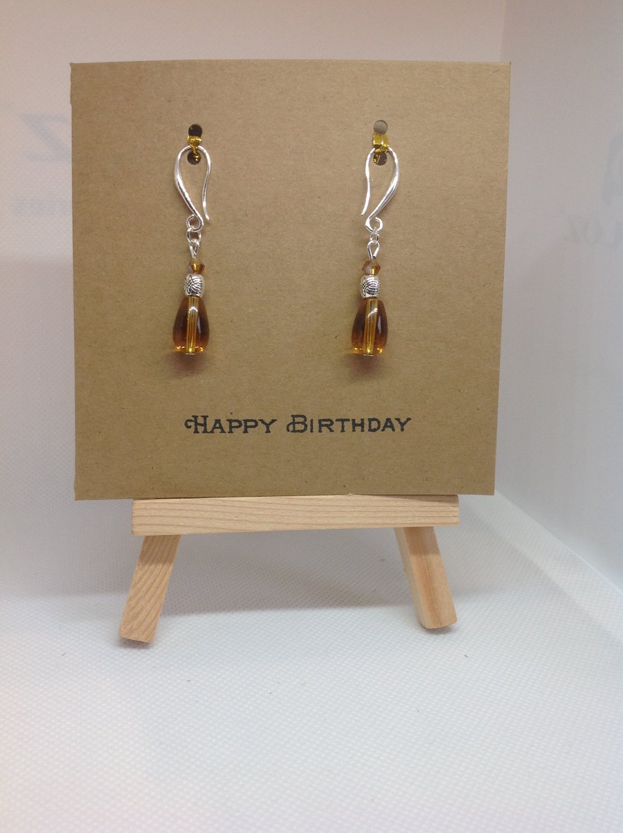 Birthday card with earrings attached