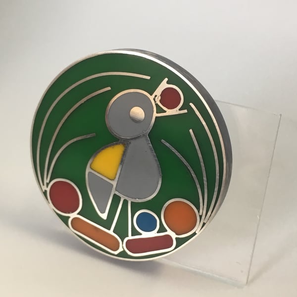 A Bower bird in his nest silver pendant.Handmade in silver with resin.