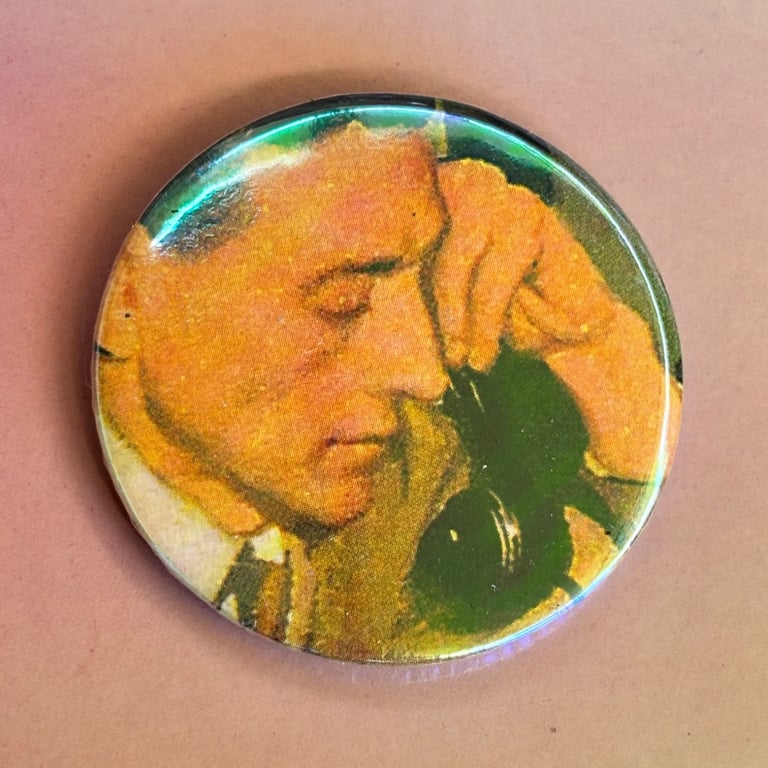 Holographic vintage book pin badge - man on the phone 