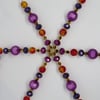 Large jewel tones snowflake or suncatcher