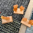 Set of three quirky orange birds on bases in resin
