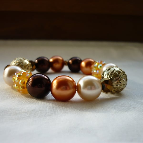 BROWN, COPPER AND GOLD BRACELET.  813