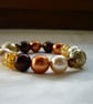 BROWN, COPPER AND GOLD BRACELET.  813 - Image 1