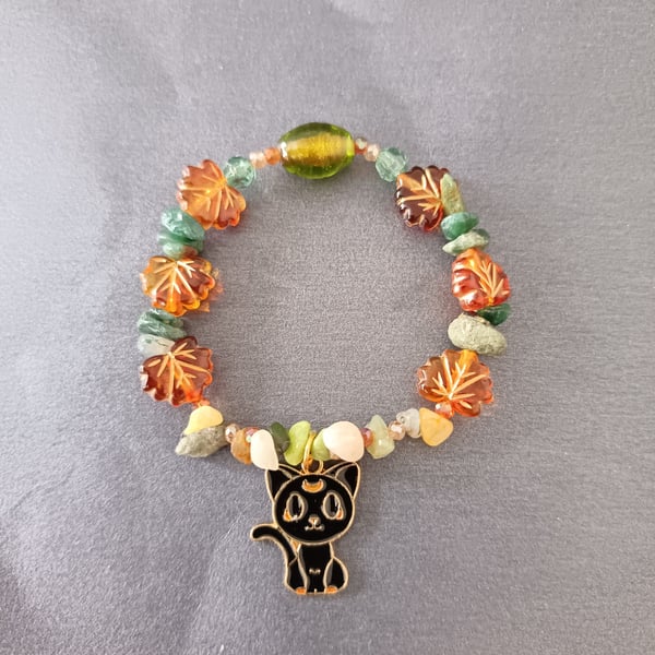 Elasticated Autumnal leaf and black cat charm bracelet 