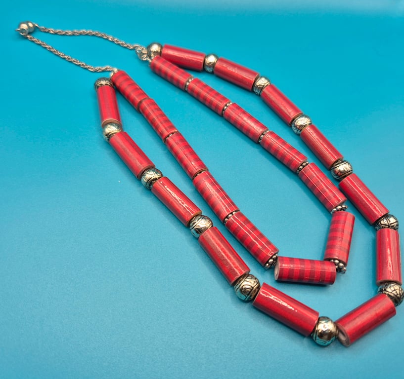 Double stranded long necklace with red lined tubular paper beads