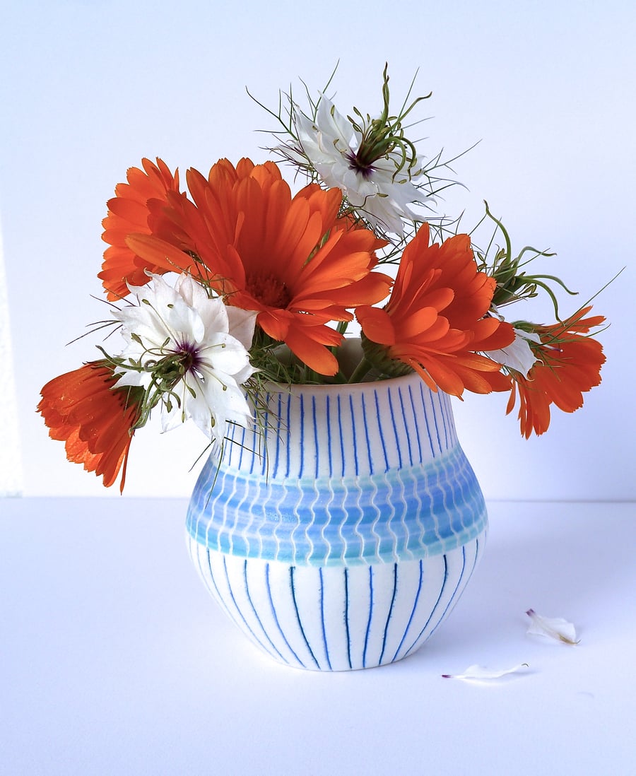 A delicate porcelain posy vase, hand thrown by Linda in her studio in Winchester