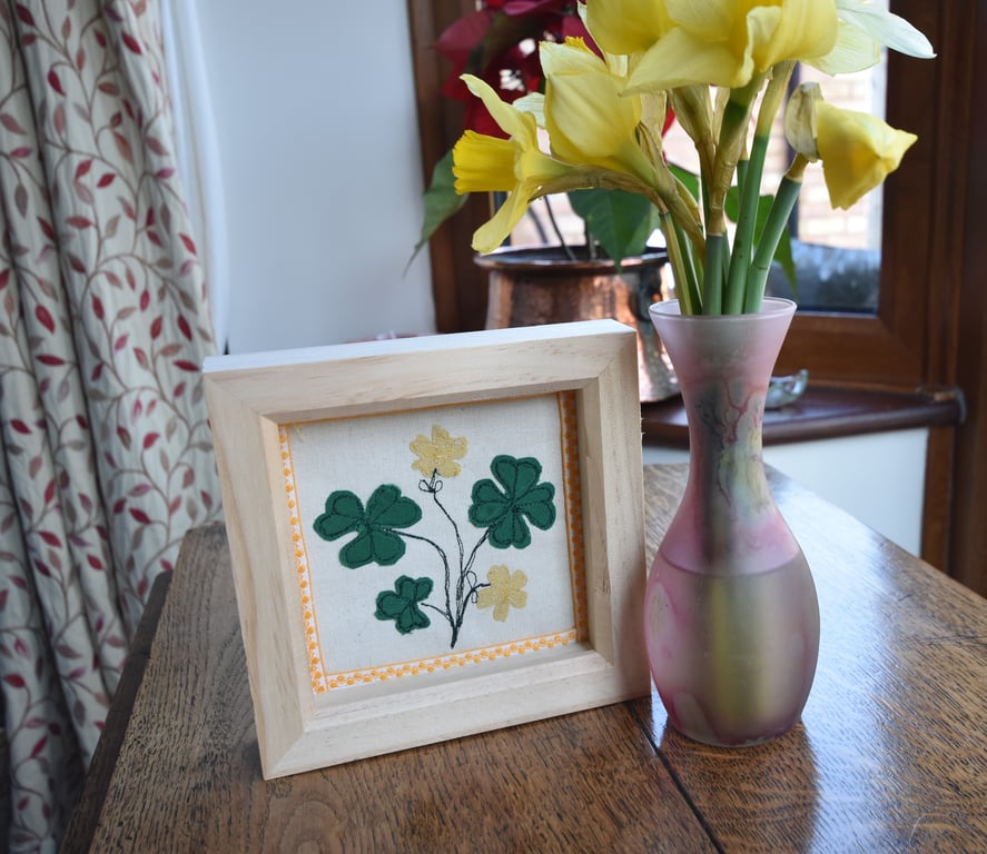 Box frame textile art picture of shamrock or clover leaves and flowers