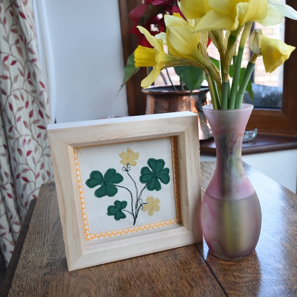 Box frame textile art picture of shamrock or clover leaves and flowers