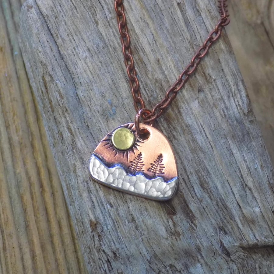 Dinky copper and silver mixed metals alpine forest pendant (Sun)