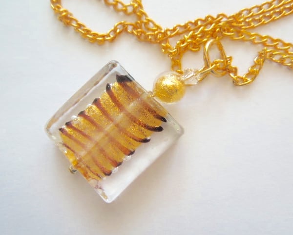 Murano glass gold spangle pendant with Swarovski crystal.