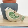 Ceramic bird decoration with patterned wing and tail 
