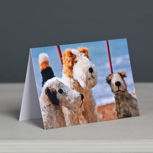 Trio of Dog on Wheels Toys Greeting Card
