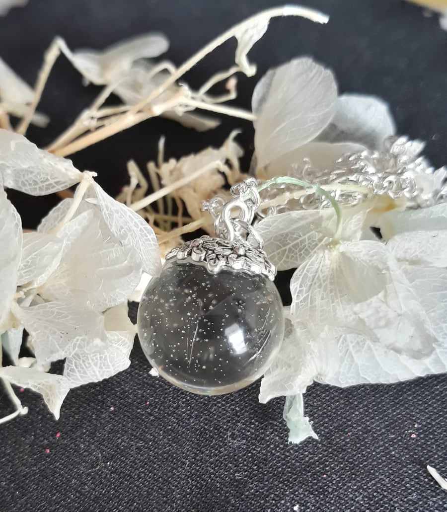 R20 Clear resin globe necklace with sparkles