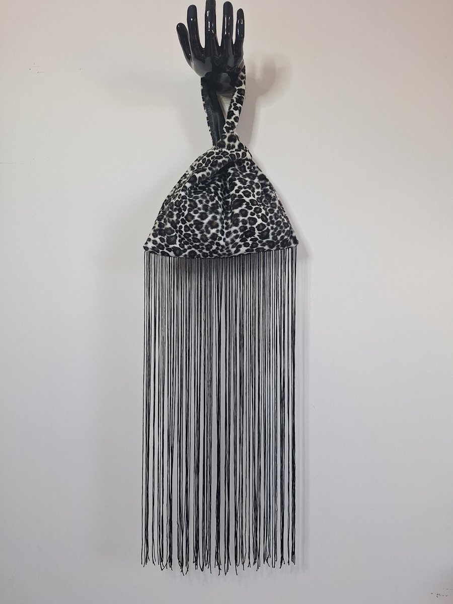 Image of Snow leopard print faux fur fabric Japanese Knot bag with 48cm black tassel trim
