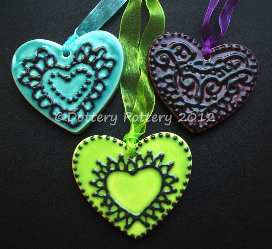 Set of three ceramic heart decorations