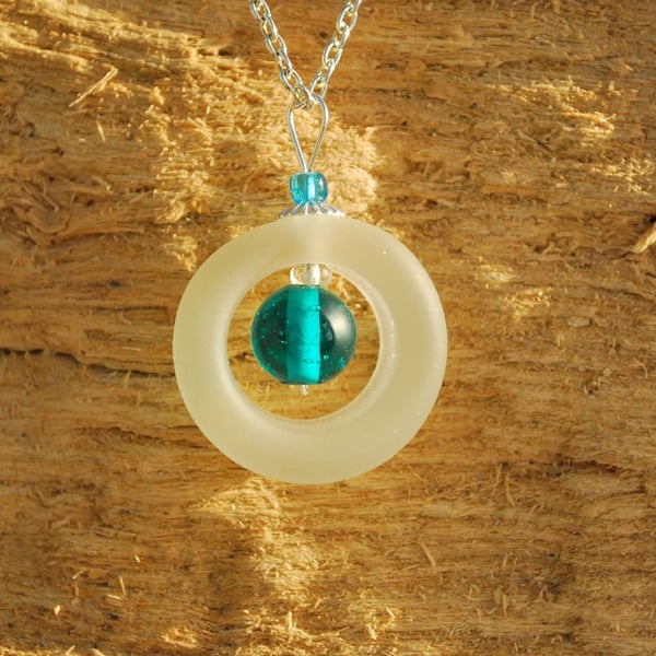 White ring pendant with turquoise bead