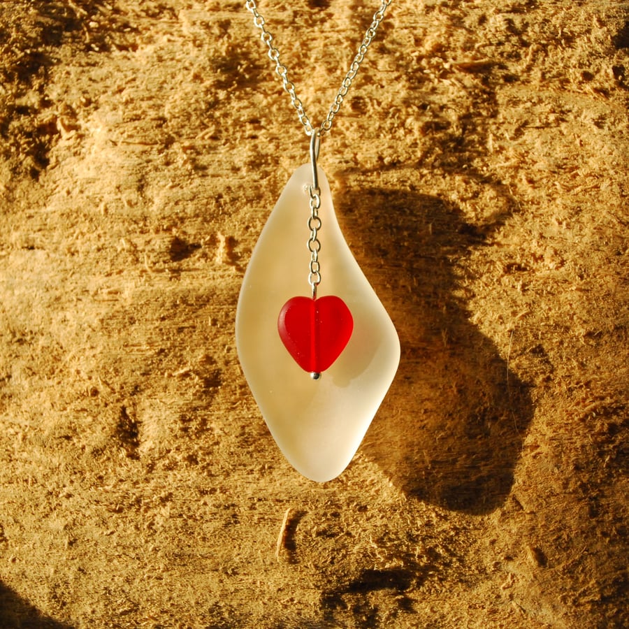 Elegant white beach glass pendant with red heart