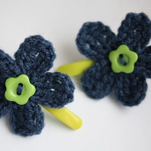 a pair of hair clips with crochet flowers, navy blue/green