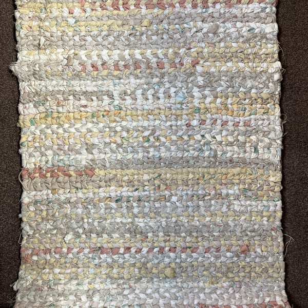Neutral white, cream and beige rag rug