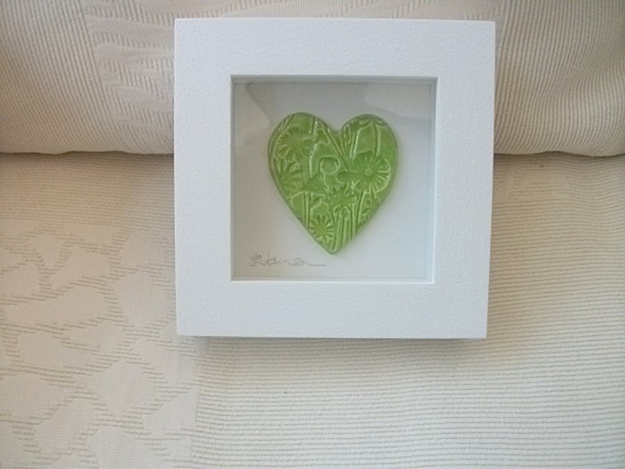 Sale Ceramic green heart impressed with a floral design, wood frame