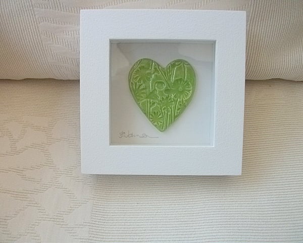 Sale Ceramic green heart impressed with a floral design, wood frame