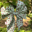 Hair bow on band in strawberry print