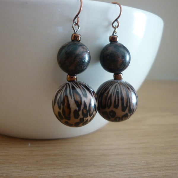 ANIMAL PRINT AND ANTIQUE COPPER EARRINGS.