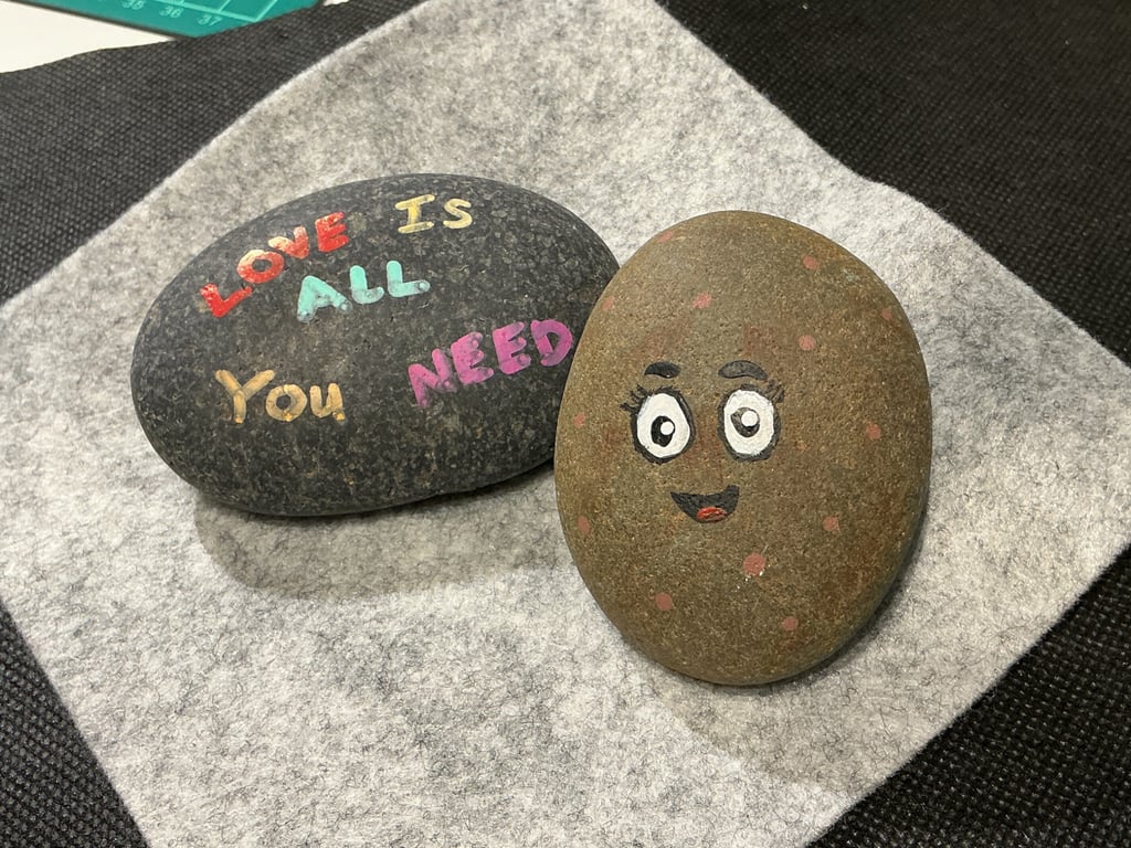 Set of 2 hand painted pebbles with love and positive theme.
