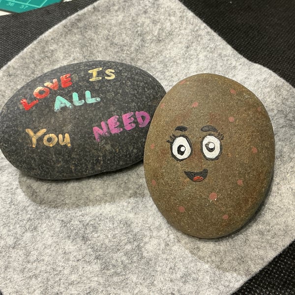 Set of 2 hand painted pebbles with love and positive theme.