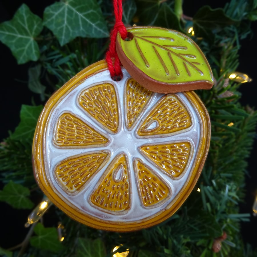Orange slice with leaf pottery decoration