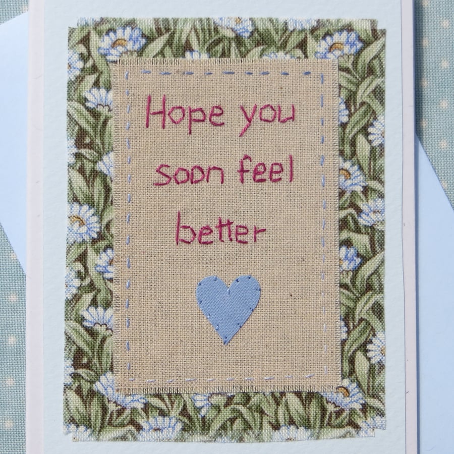 Hand-stitched words, pretty floral  fabric and applique heart