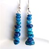 Earrings for pierced ears, sensational blue coral dangles.