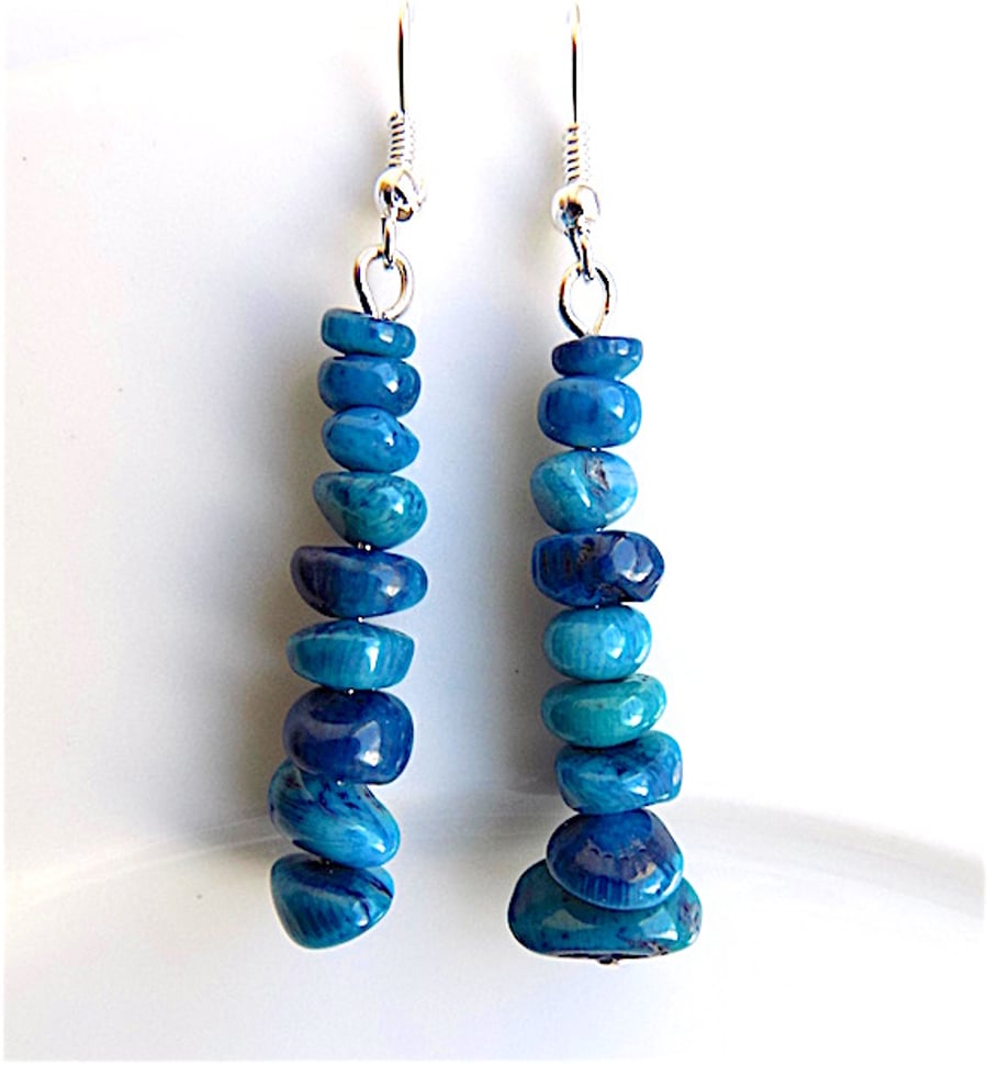 Earrings for pierced ears, sensational blue coral dangles.