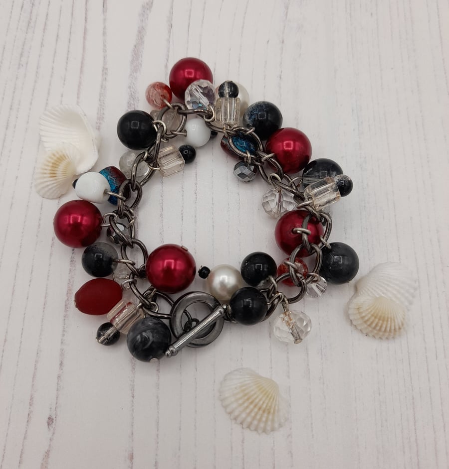 Black, white and red charm style bracelet