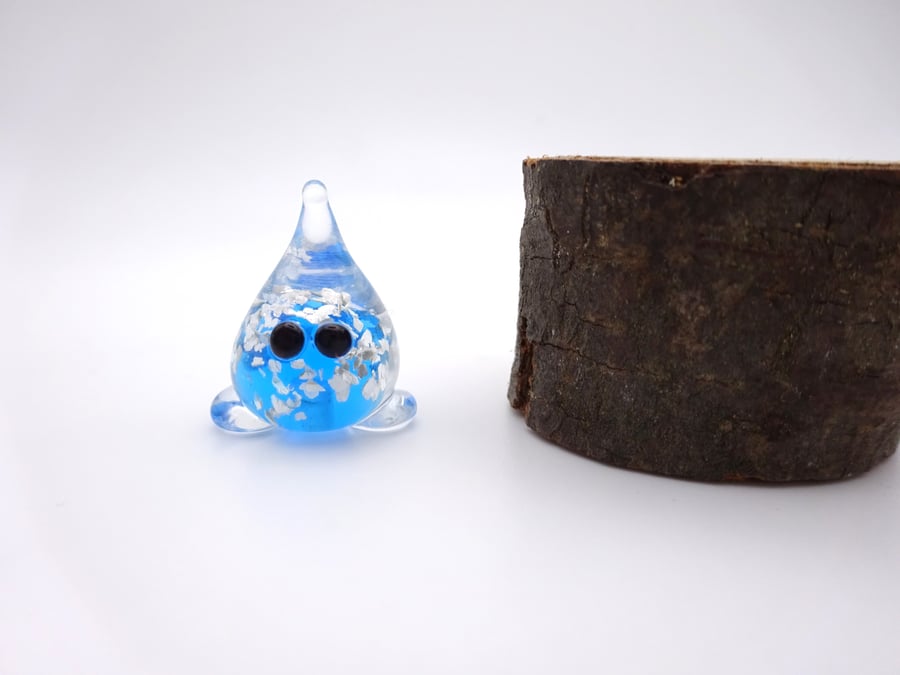 small glass wisp figure