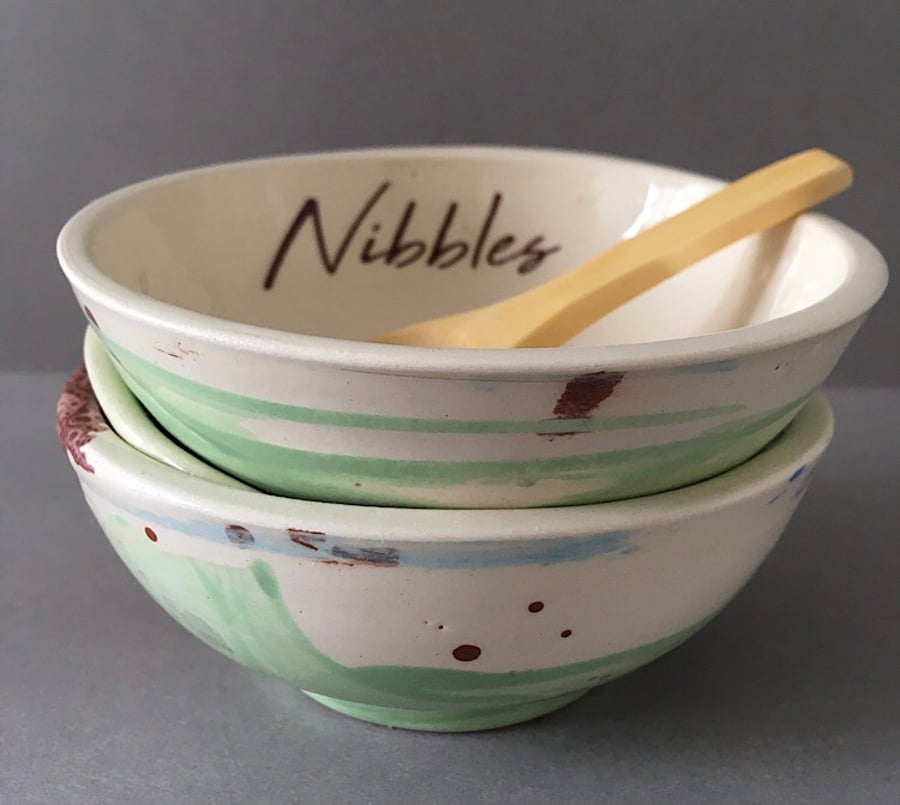 Ceramic nibbles dish and scoop.