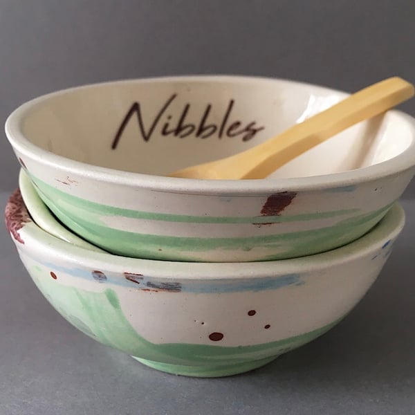 Ceramic nibbles dish and scoop.