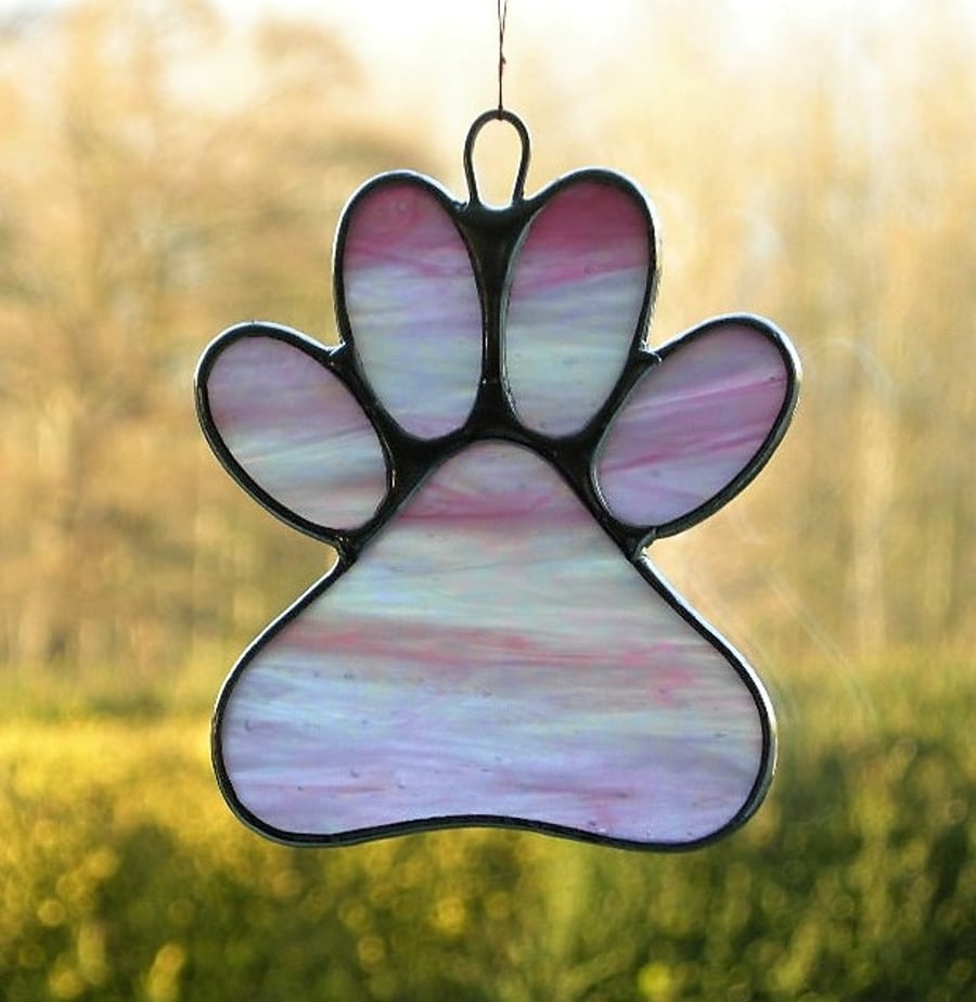 Paw Print suncatcher in pink and white translucent iridescent glass