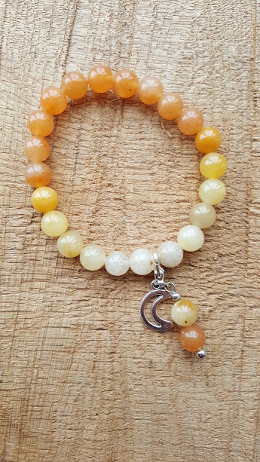 Yellow jade and orange aventurine ombre effect stretch beaded charm bracelet